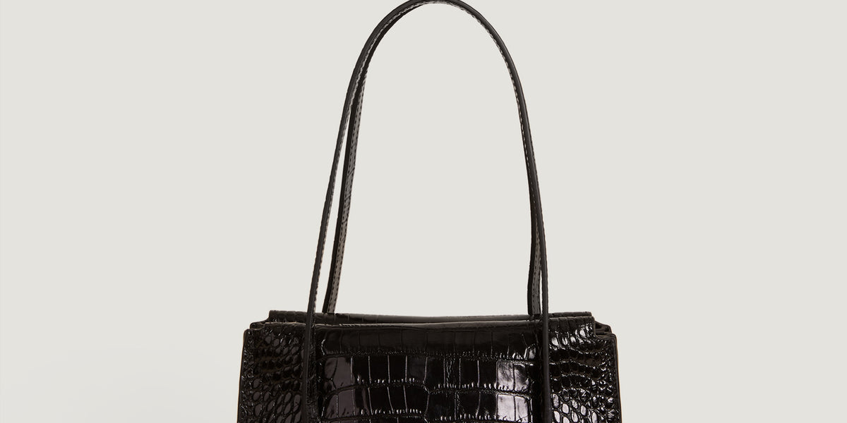 Black croco-like leather handbag