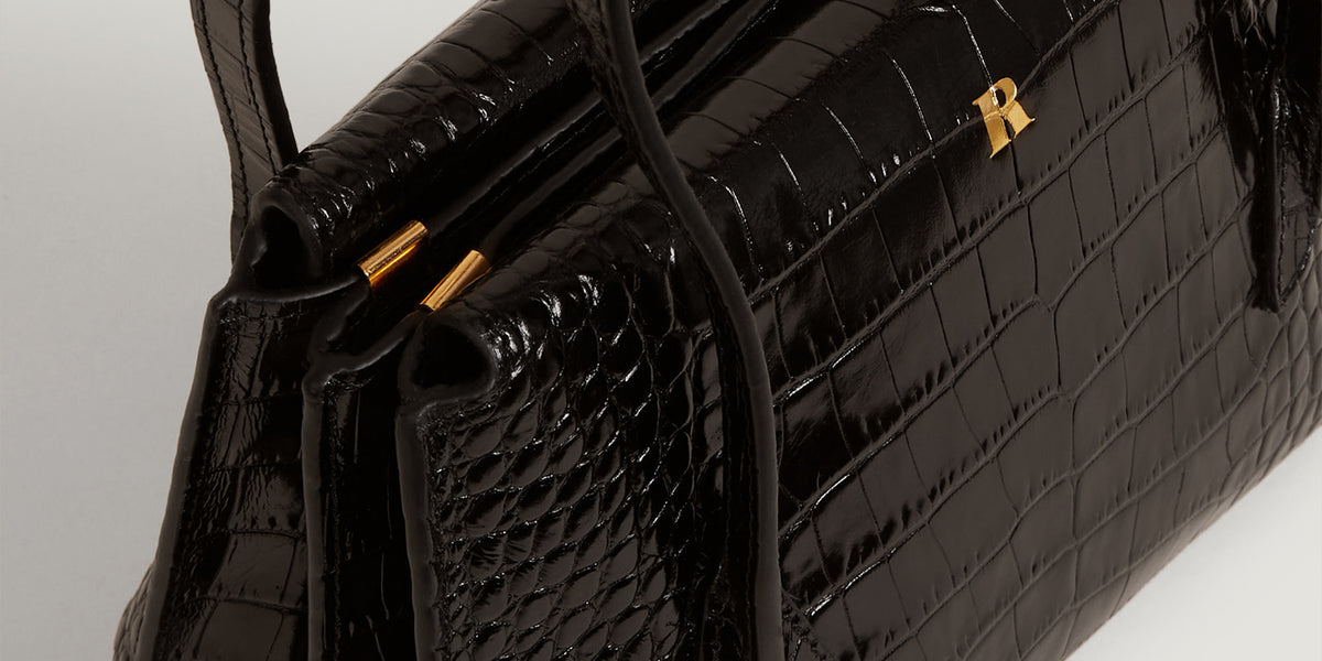 Black croco-like leather handbag