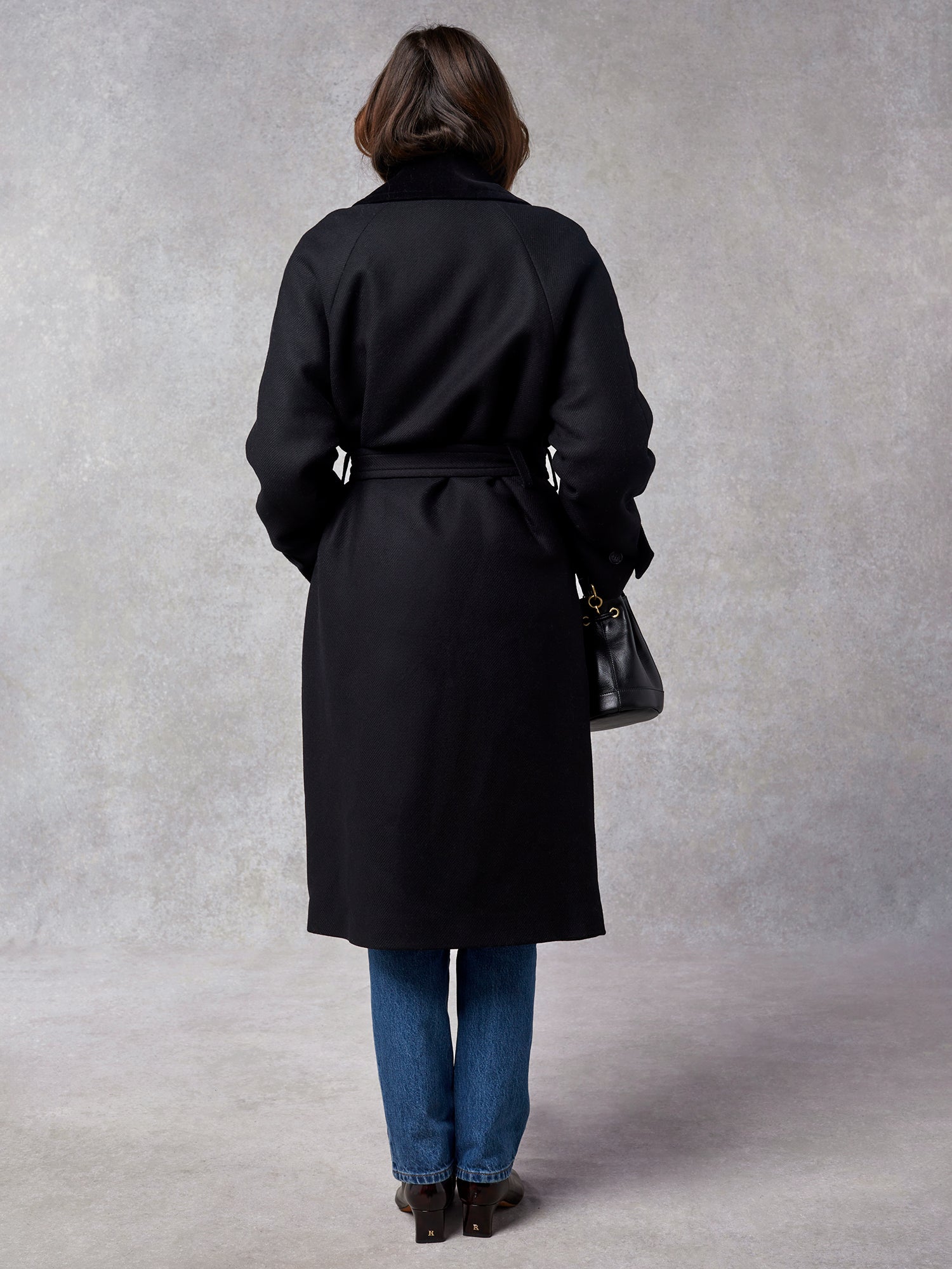 Oversized double-breasted and belted black wool coat | Rouje