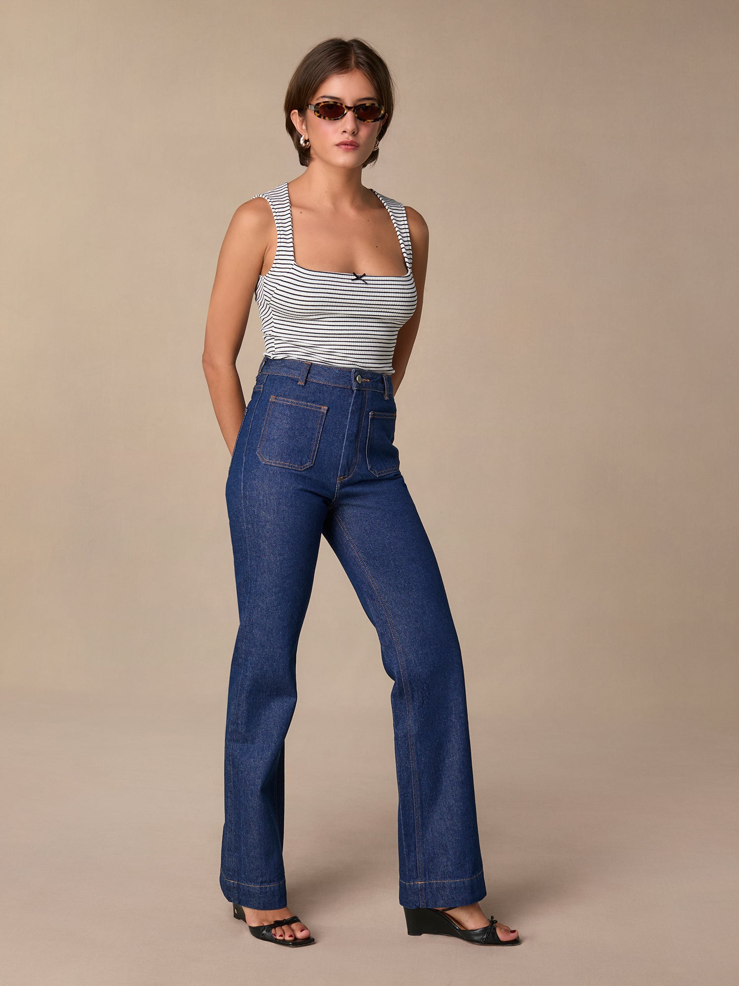 Long flare raw jeans with front pockets • Rouje Paris